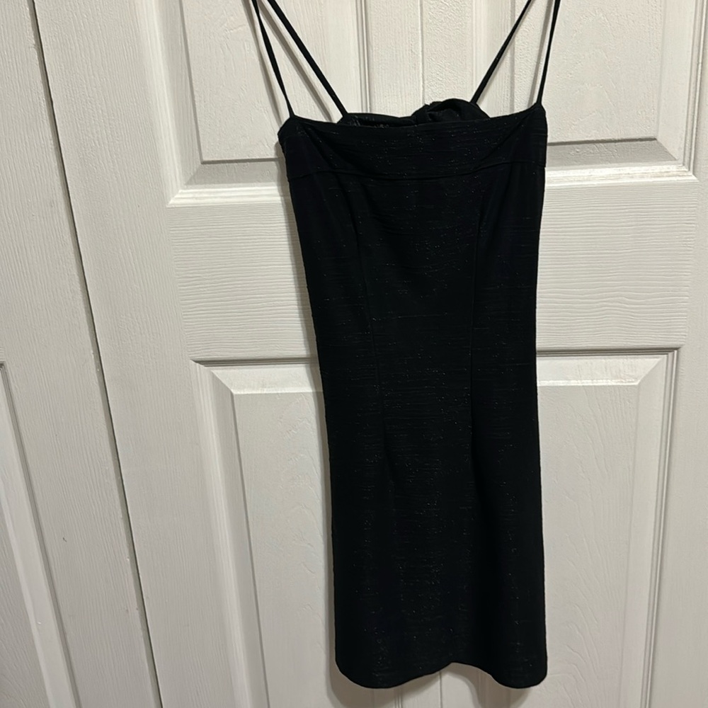 Black mini dress that has little specs of silver